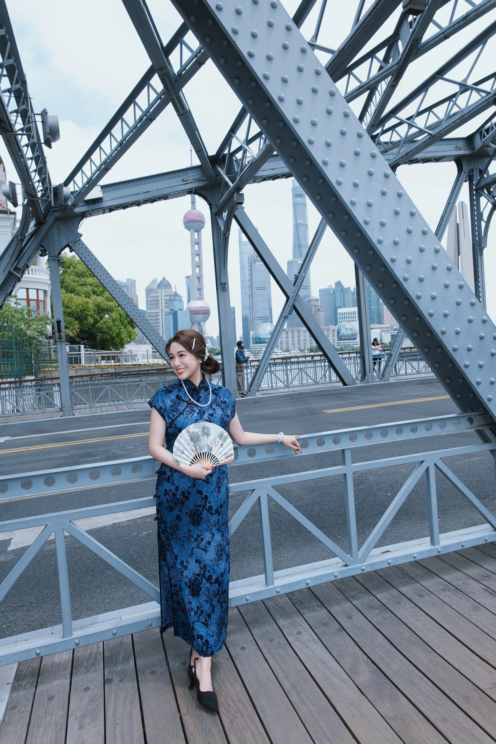 Tiffany Iris — Blue dress on a steel bridge