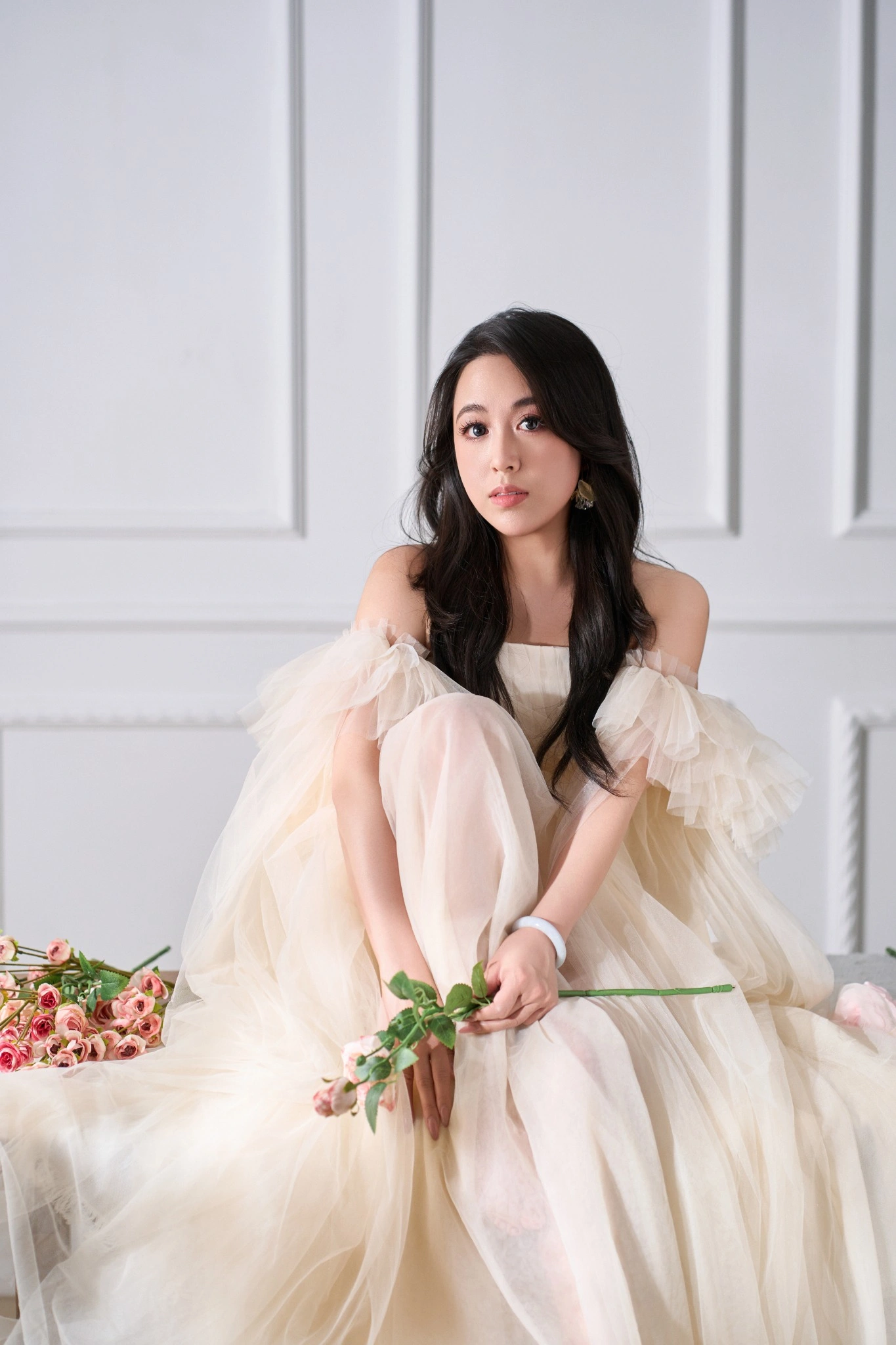 Tiffany Iris — Seated ivory-dress portrait